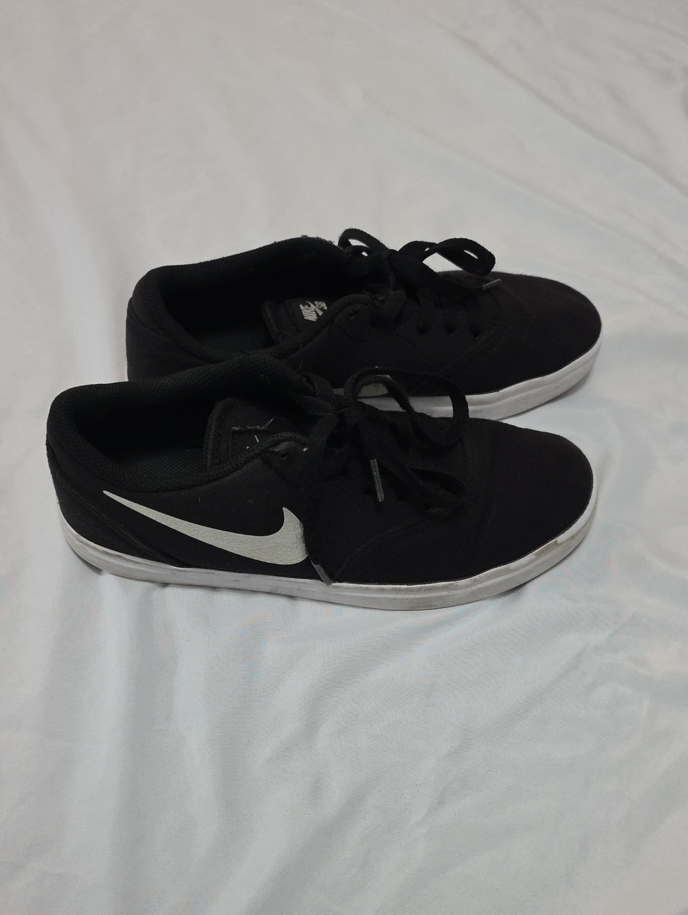Nike Black Low-Top Sneakers with White Swoosh